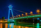 Fototapeta Fototapety z mostem - Night view of the illuminated SNP bridge over Danube in Bratislava