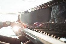 Woman Playing A Piano