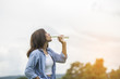 © sunti - young beautiful woman drinking water