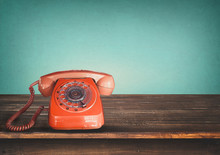 Old Retro Red Telephone On Table With Vintage Green Pastel Background