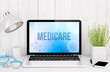 © MclittleStock - medical desktop computer with medicare on screen