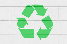 Recycling Symbol On  Stone Wall Of Building