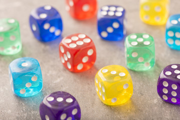 Colorful dice in close up. Concept image of leisure game, risk and chance. Symbol of success or luck.