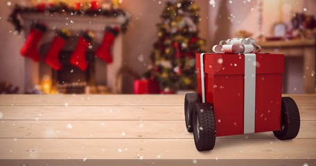Poster - Composite image of red gift box on wheels