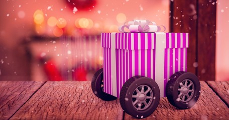 Poster - Composite image of gift on wheels