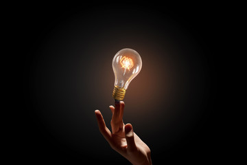 Wall Mural - hand pointing light bulb . mixed media