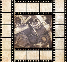 Various Old (unidentified, Unrecognized) Photo Cameras On Textured Old Paper Background With Film Strips.Photo Abstract Background. Tone Colors. Old Style Image