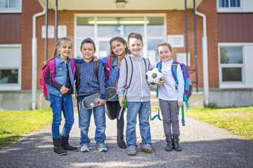 students outside school standing together