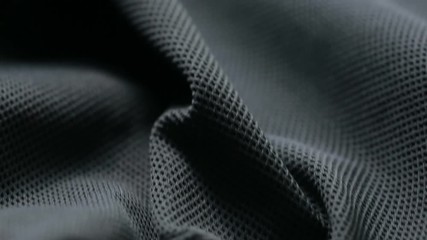 mesh cloth. black synthetic fabric. can be used as a background