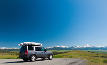 SUV Overlooking Cascade Mountain Range