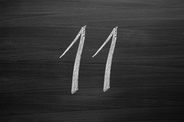 Wall Mural - number eleven enumeration written with a chalk on the blackboard