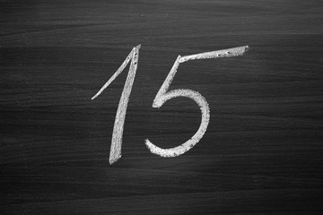 Wall Mural - number fifteen enumeration written with a chalk on the blackboard