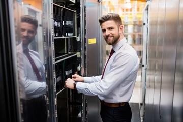 Fototapete - Technician examining server