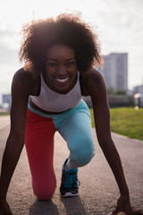 Portrait of sporty young african american woman running outdoors