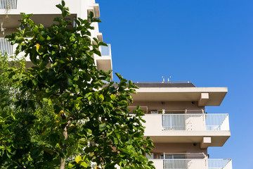 Wall Mural - Residence image, apartment building against blue sky