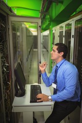 Aufkleber - Technician working on personal computer while analyzing server