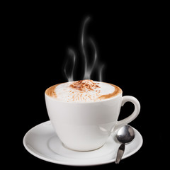 Hot cappuccino with cinnamon in a white cup.