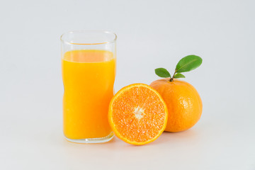 Orange juice and slices of orange isolated on white