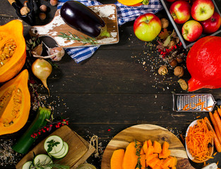 Wall Mural - Autumn vegetables and fruits on a dark wooden board.