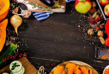 Wall Mural - Autumn vegetables and fruits on dark wooden board.