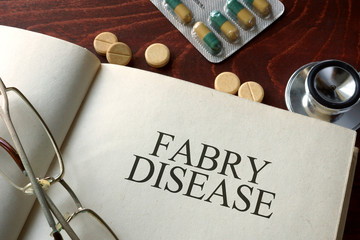 Wall Mural - Book with diagnosis Fabry disease and pills. Medical concept.