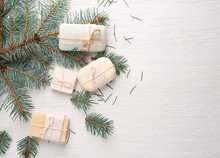 Pieces Of Coniferous Soap And Branches On Wooden Background