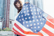 © instax - Young Beautiful Woman Waving an US Flag Brooklyn . New York City US