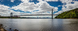 George Washington Bridge spans Hudson River and connects New York and New Jersey. Panoramic view with Manhattan skyline in the background