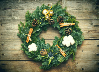 Wall Mural - Christmas wreath on the wooden background