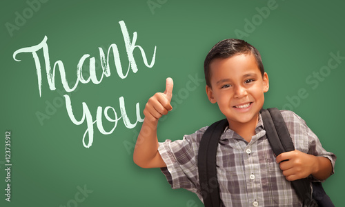 Cute Hispanic Boy with Thumbs Up in Front of Chalk Board with Thank You Writt...