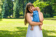 © andriano_cz - Beautiful mother and her baby playing in park
