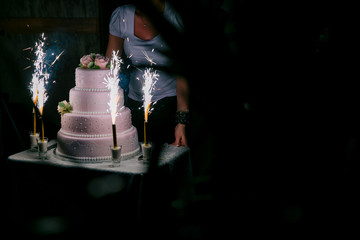 Wedding cake and sticks with fire