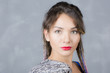 © nadezhdaabramian - Woman portrait with colorful dreadlocks is a studio, hippie style. Beautiful modern girl has makeup and wears jacket on shoulder, close-up.