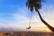 Woman Relaxing On Swing, Tropical Paradise Beach At Sunset, Vacation