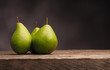 Three pears on wood with space for text