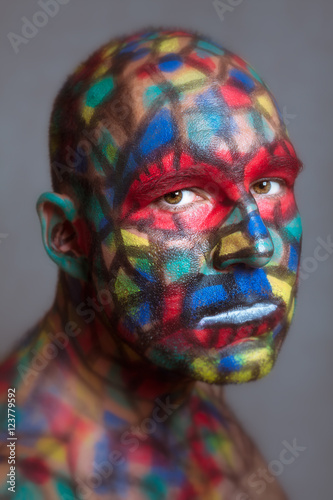 Fotografie, Obraz Serious villain colorful face looking at you