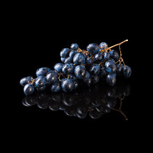 Bunch Of Blue Grapes Isolated On Black