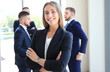 © ty - Face of beautiful woman on the background of business people