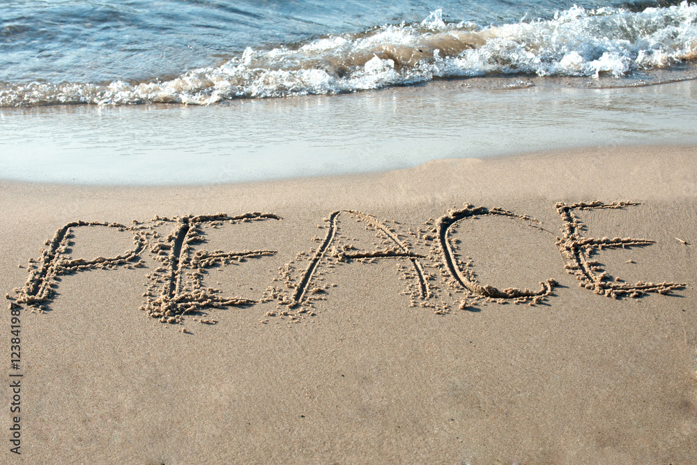Peace written in the sand on the beach Stock Photo | Adobe Stock