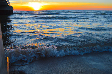 Brilliant sunrise over the waters of lake Huron in Oscoda, Michigan