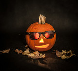 Fototapeta  - Halloween pumpkin with sunglasses