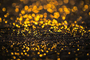 Wall Mural - glitter vintage lights background. dark gold and black. defocuse