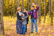 © satura_ - Portrait Of Happy Family on autumn nature