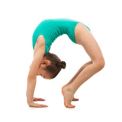 Wall Mural - Flexible little girl gymnast doing a bridge on white background