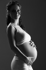 Wall Mural - belly of pregnant woman monochrome