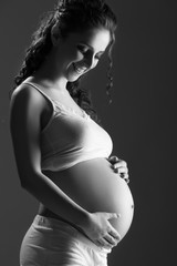 Wall Mural - belly of pregnant woman monochrome