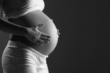 Wall Mural - belly of pregnant woman monochrome