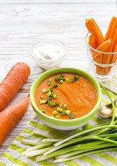 Wall Mural - Carrot puree soup with sour cream and green onion