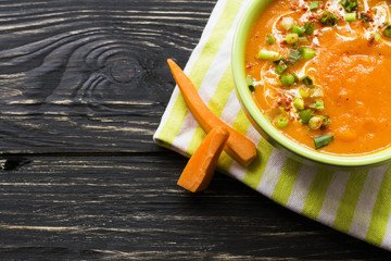 Wall Mural - Carrot puree soup with sour cream and green onion