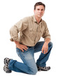 Full-length construction worker building contractor carpenter serviceman kneeling isolated on white background